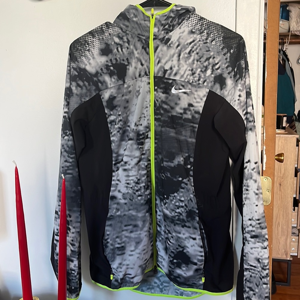 Nike medium running jacket, never worn.